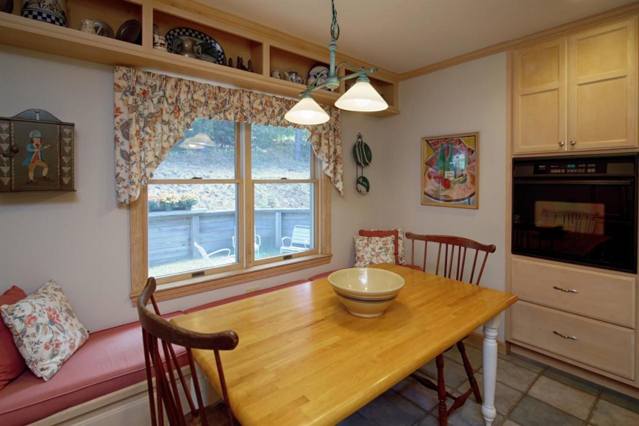 188 Abbey Gate Road Cotuit, MA 02635 - Photo 9 of 23 a view of a dining room with furniture and a window
