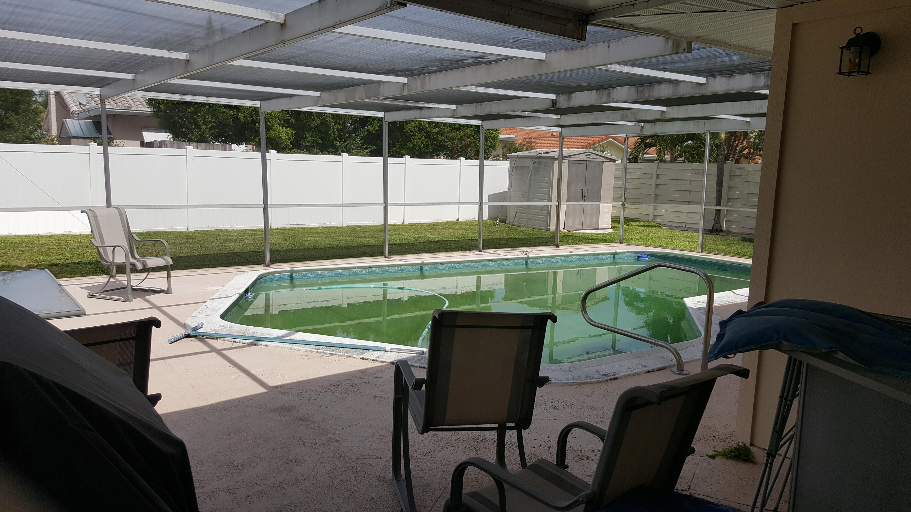 650 Southwest 12th Terrace Boca Raton, FL 33486 - Photo 12 of 13 SCREENED POOL AND PATIO