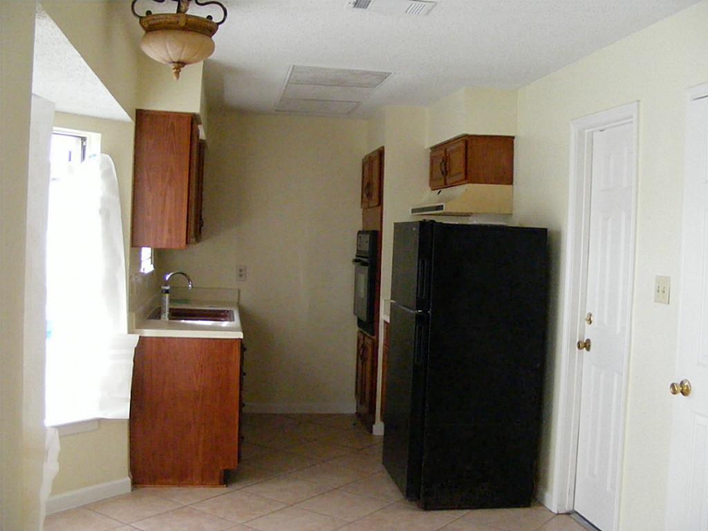 1615 Mosher Lane Houston, TX 77088 - Photo 5 of 10 a room with storage and utility