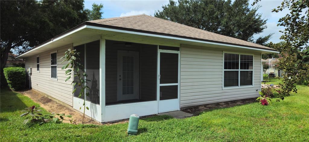 1568 Grove Court Tavares, FL 32778 - Photo 15 of 15 a front view of a house with garden