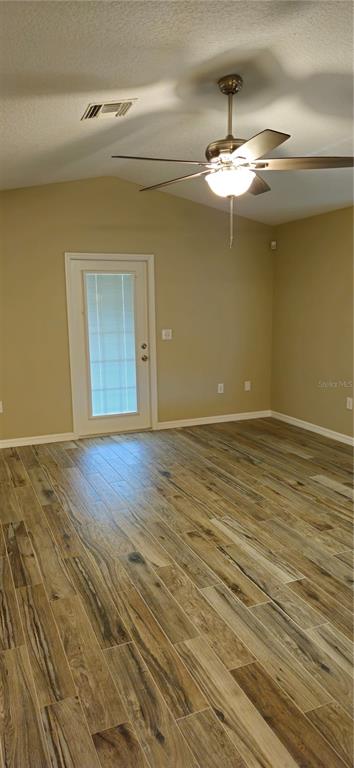 1568 Grove Court Tavares, FL 32778 - Photo 7 of 15 a view of a livingroom with a chandelier