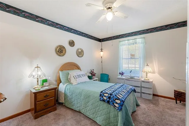a bathroom with a sink vanity mirror and toilet