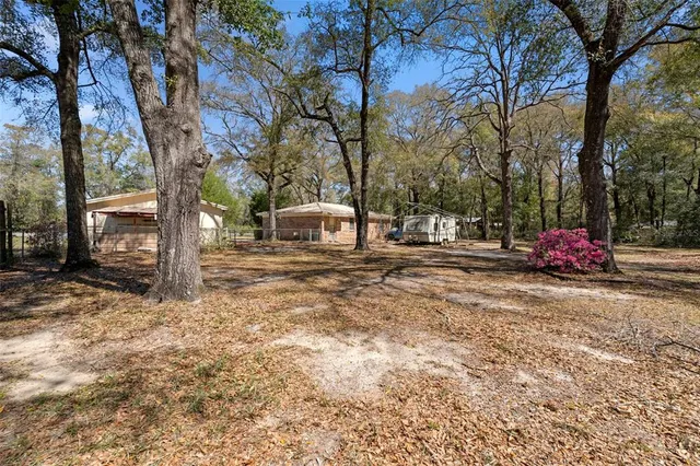 a room with stainless steel appliances kitchen island granite countertop furniture and a kitchen view
