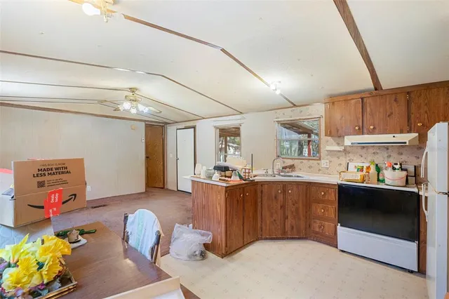 a view of a playground with a house