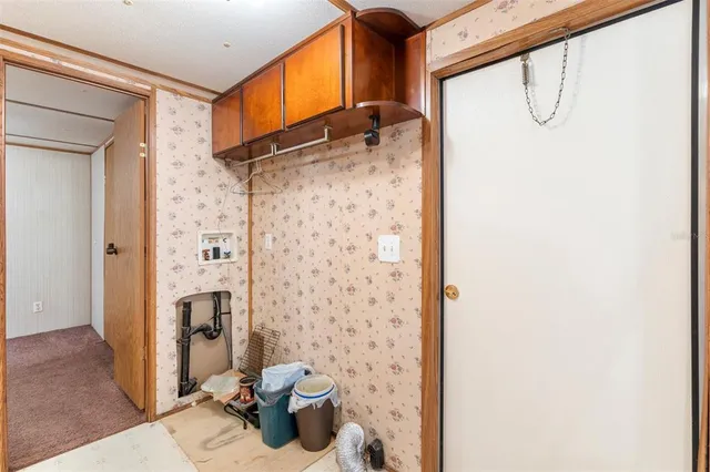 a kitchen with stainless steel appliances granite countertop a refrigerator stove and sink