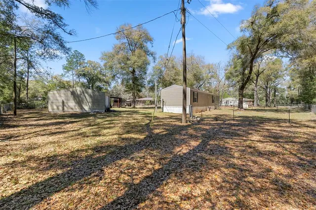 a bathroom with a sink a toilet and a shower curtain