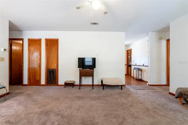a view of a livingroom with furniture and a couch