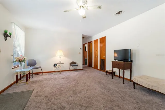 a kitchen with stainless steel appliances granite countertop a stove a sink dishwasher and a refrigerator with wooden cabinets