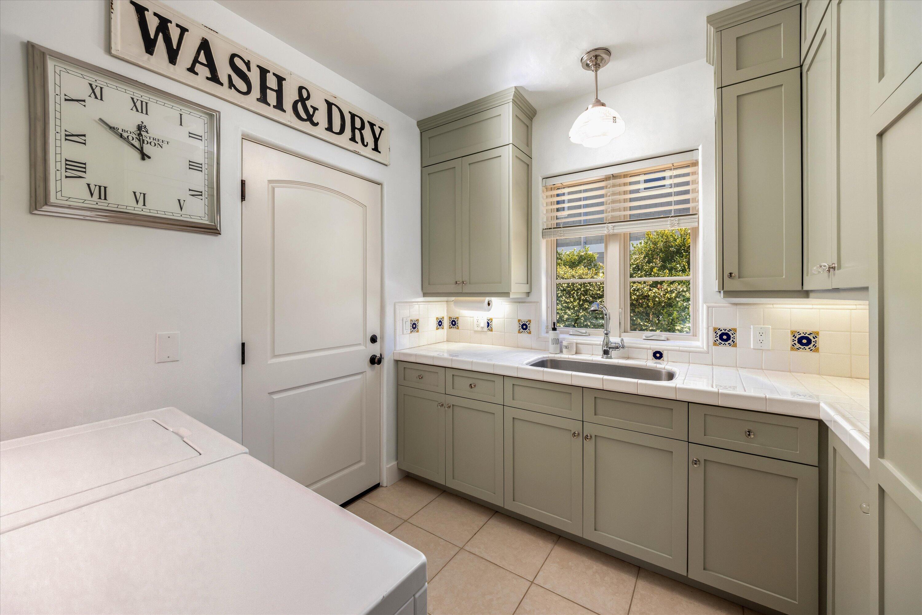 333 Conejo Road Santa Barbara, CA 93103 - Photo 28 of 43 a kitchen with a sink and cabinets