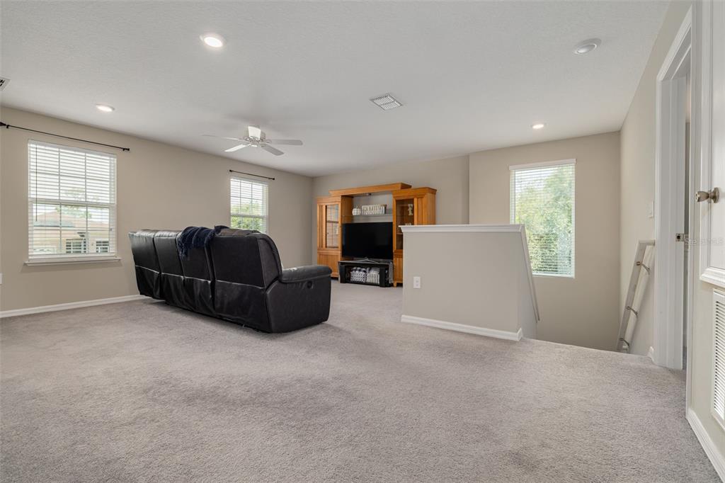 7242 Landmark Drive Spring Hill, FL 34606 - Photo 26 of 45 a living room with furniture and a window