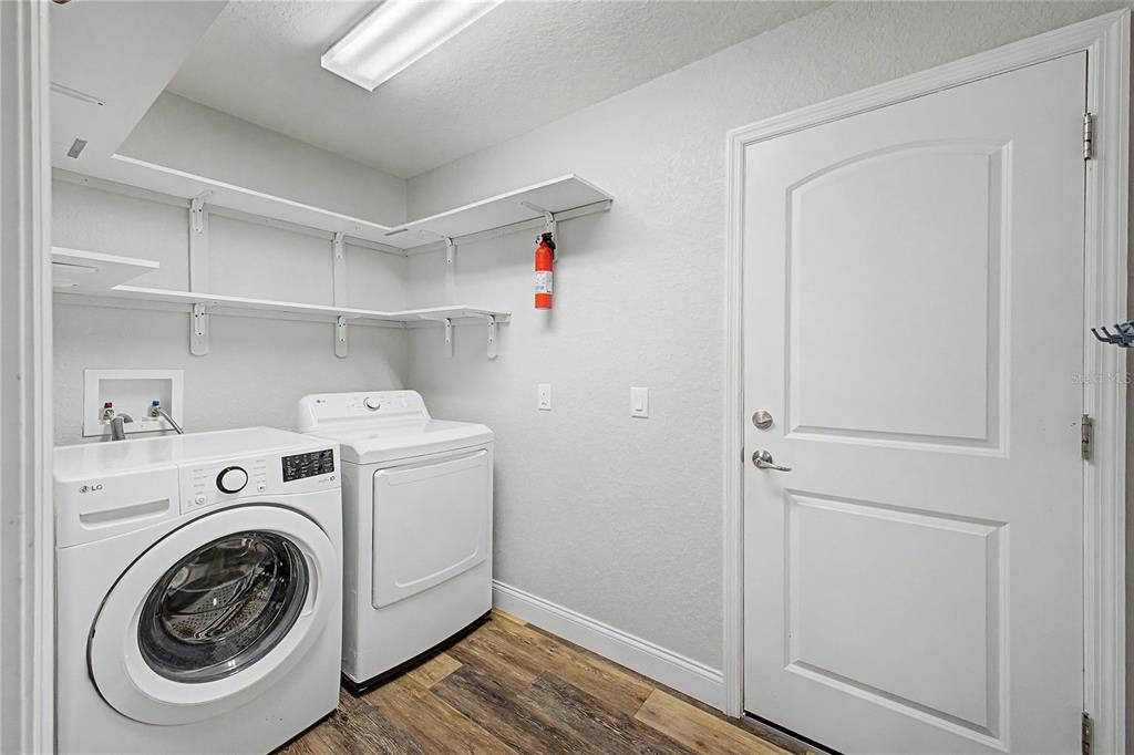11213 Flock Avenue Weeki Wachee, FL 34613 - Photo 35 of 46 a utility room with dryer and washer