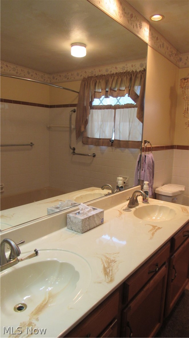 6841 Navarre Road Southwest Massillon, OH 44646 - Photo 15 of 50 Mirrored Wall, Double Vanity, window.