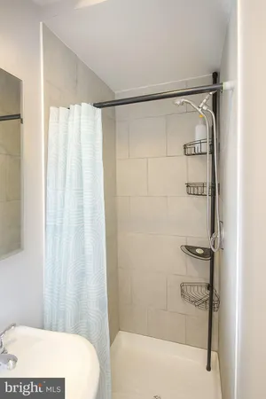 a bathroom with a shower and a tub