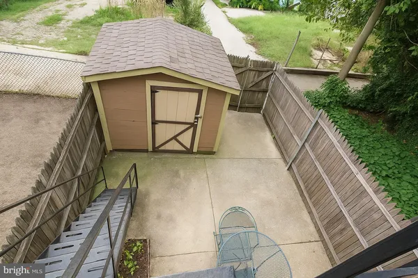 a view of a backyard with sitting area