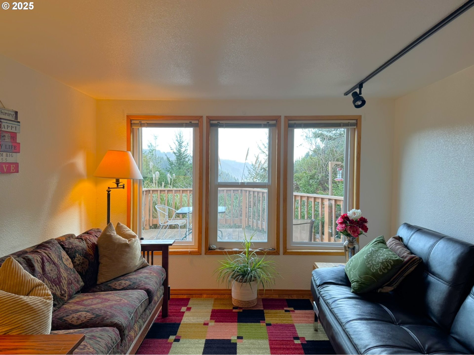 19921 Whaleshead Road, Unit OV13 Brookings, OR 97415 - Photo 13 of 43 a living room with furniture and a window