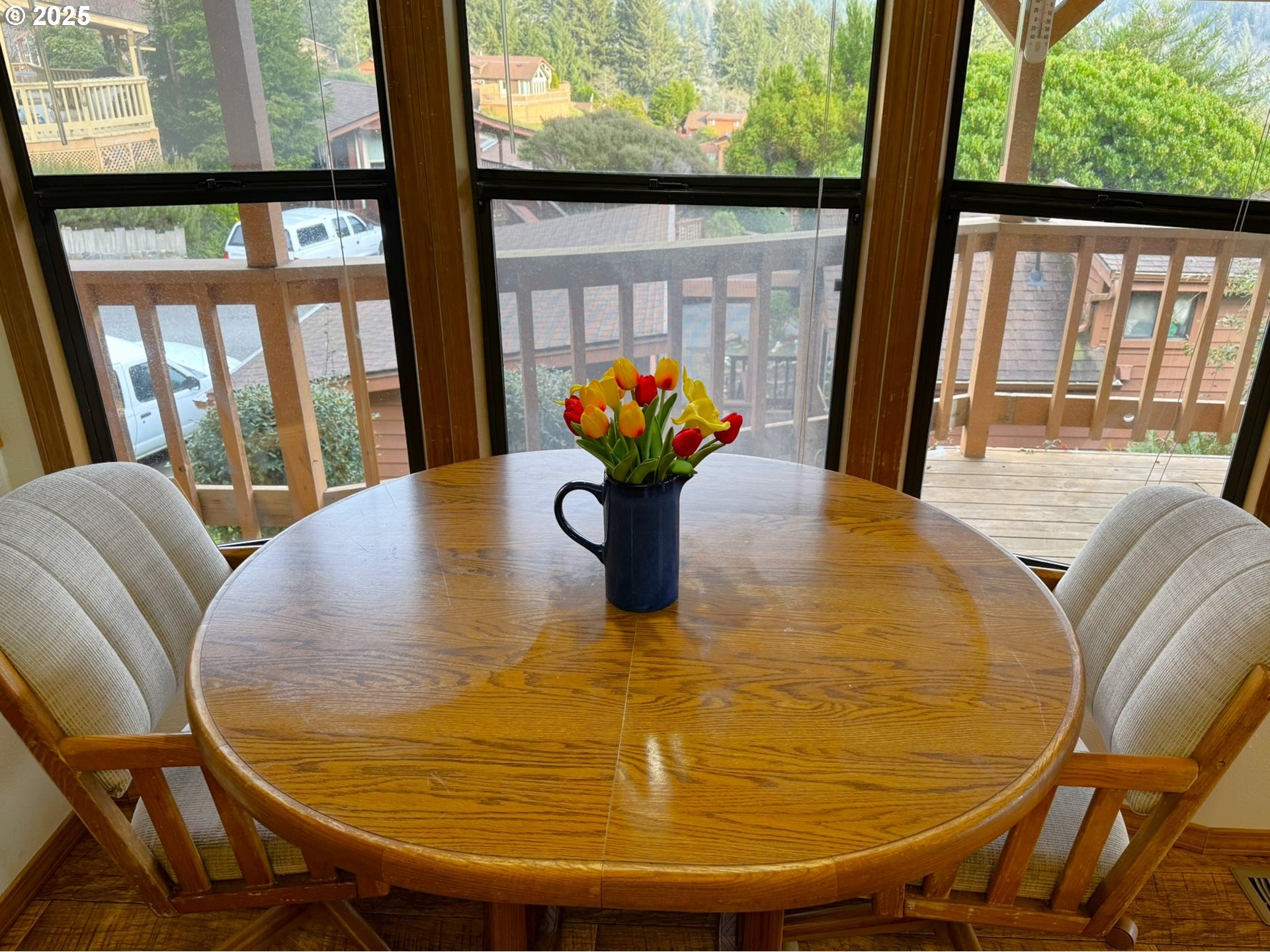 19921 Whaleshead Road, Unit OV13 Brookings, OR 97415 - Photo 19 of 43 a view of a dining room with furniture window and wooden floor