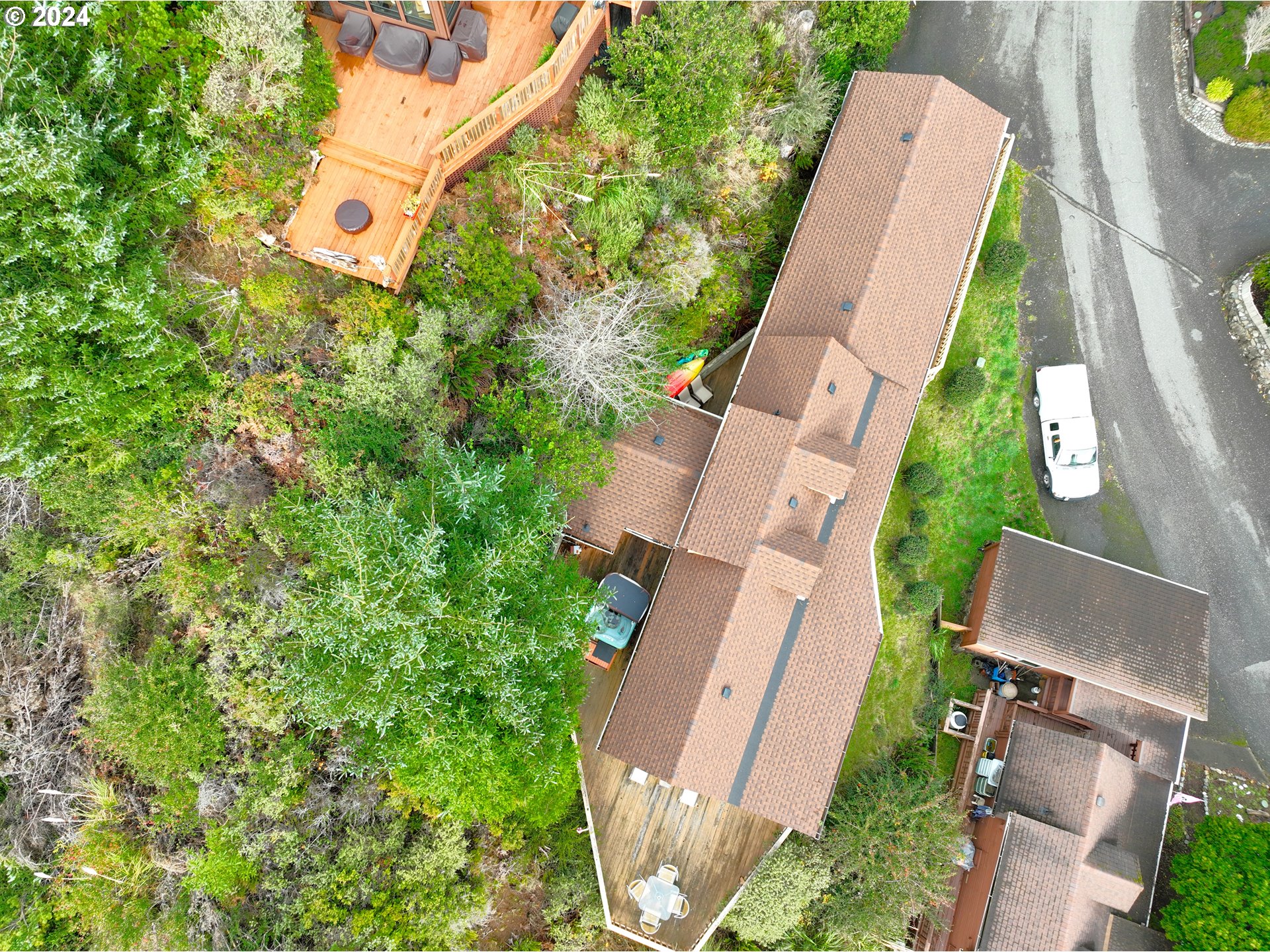19921 Whaleshead Road, Unit OV13 Brookings, OR 97415 - Photo 20 of 43 an aerial view of a residential houses with yard