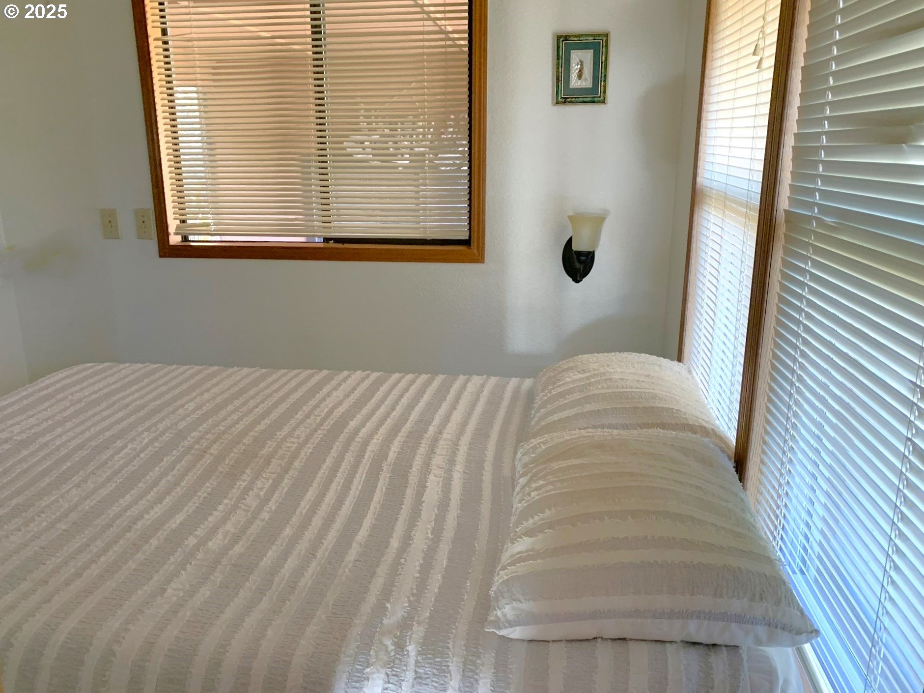 19921 Whaleshead Road, Unit OV13 Brookings, OR 97415 - Photo 22 of 43 a bedroom with a bed and a window
