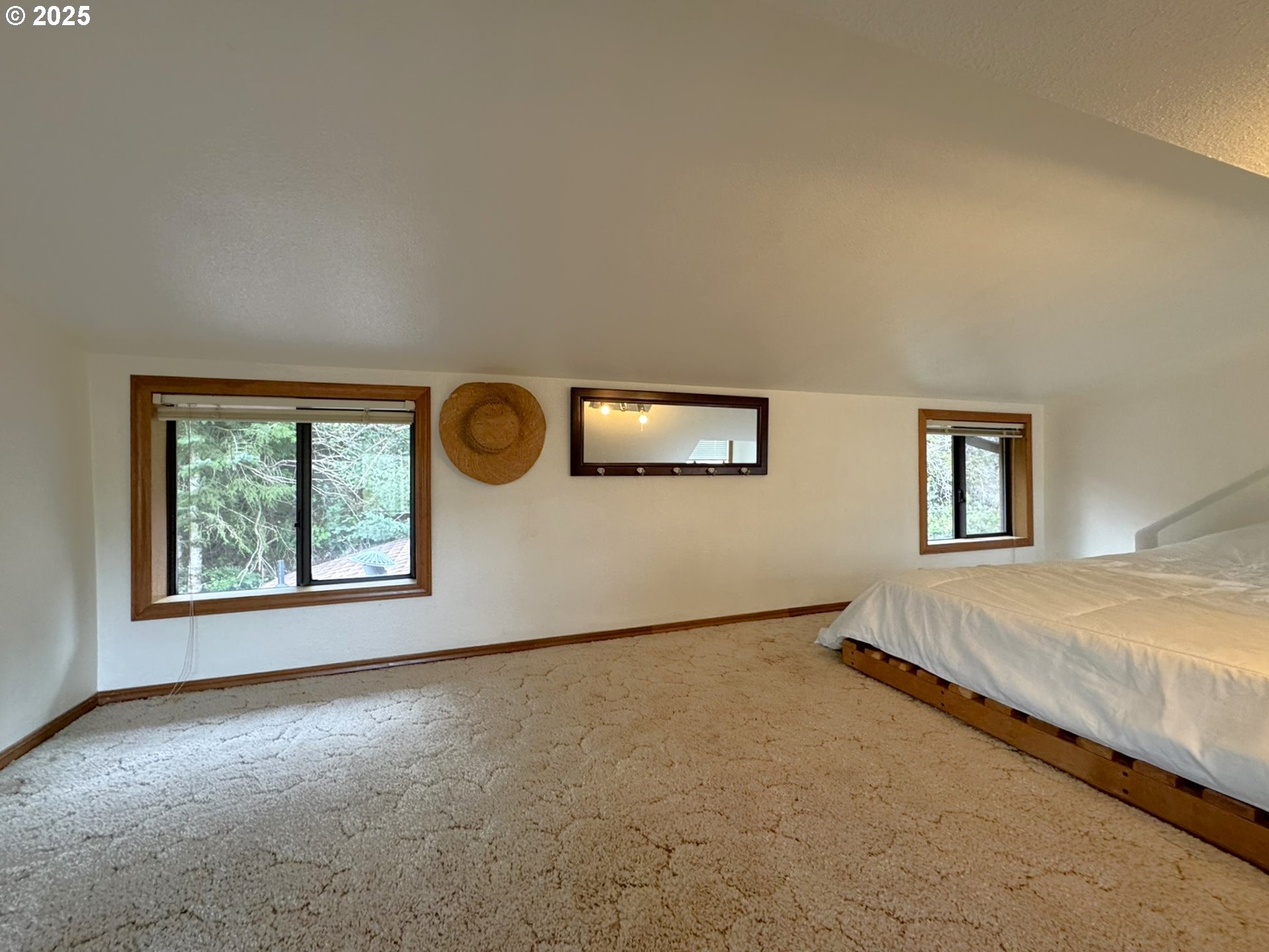19921 Whaleshead Road, Unit OV13 Brookings, OR 97415 - Photo 30 of 43 an empty room with windows