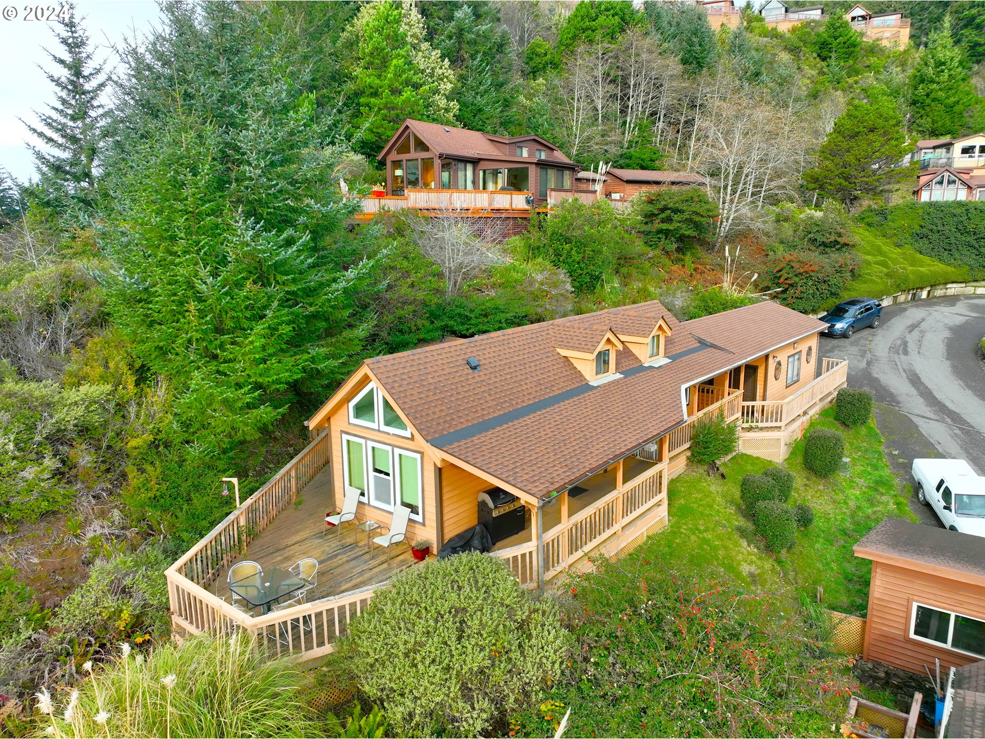 19921 Whaleshead Road, Unit OV13 Brookings, OR 97415 - Photo 3 of 43 an aerial view of house with yard and trees