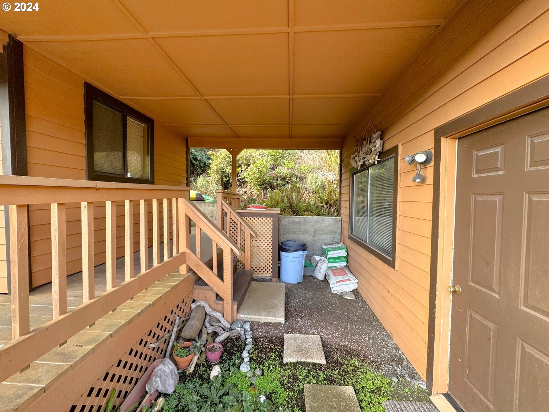 19921 Whaleshead Road, Unit OV13 Brookings, OR 97415 - Photo 32 of 43 a view of a porch with furniture