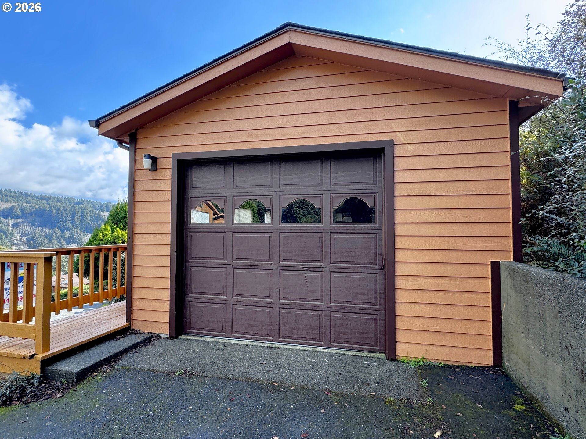 19921 Whaleshead Road, Unit OV13 Brookings, OR 97415 - Photo 39 of 43 a view of a house with a garage