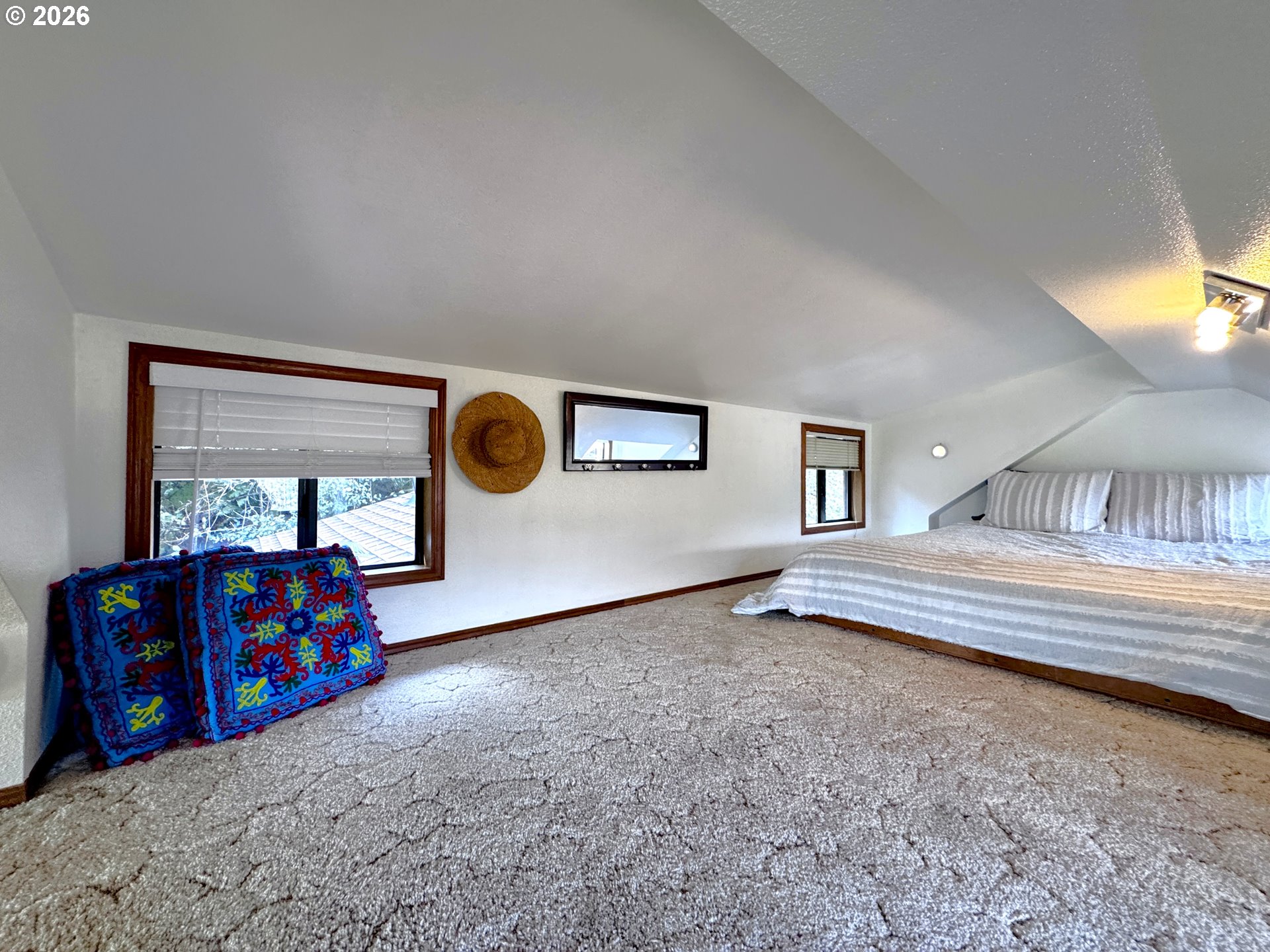 19921 Whaleshead Road, Unit OV13 Brookings, OR 97415 - Photo 42 of 43 a bedroom with a bed and window