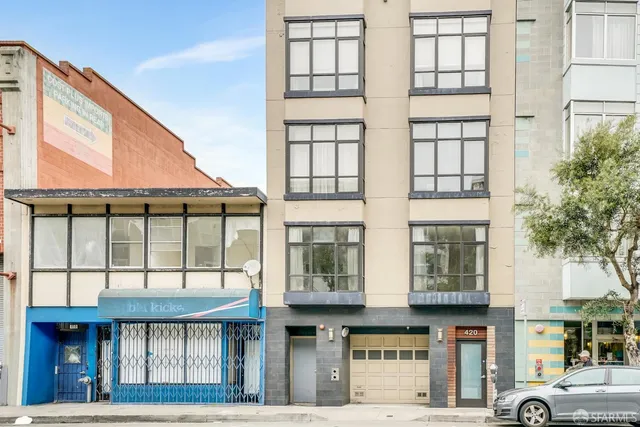 a front view of a building with glass windows