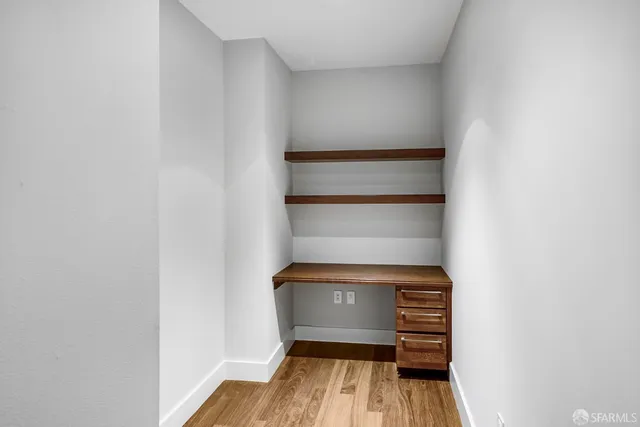 a view of room with wooden floor