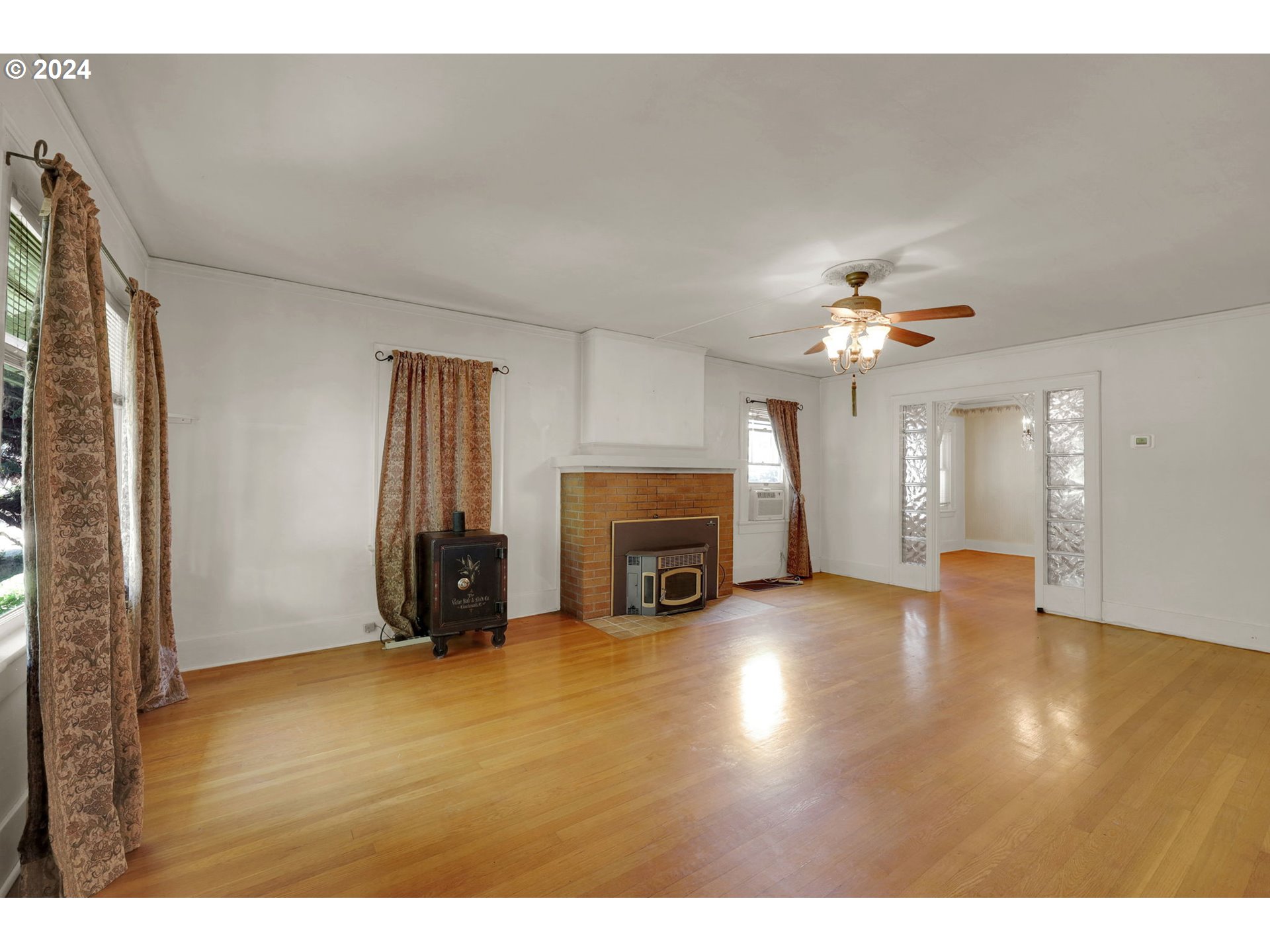 110 Elkay Drive Eugene, OR 97404 - Photo 4 of 29 a view of a livingroom with a fireplace and window