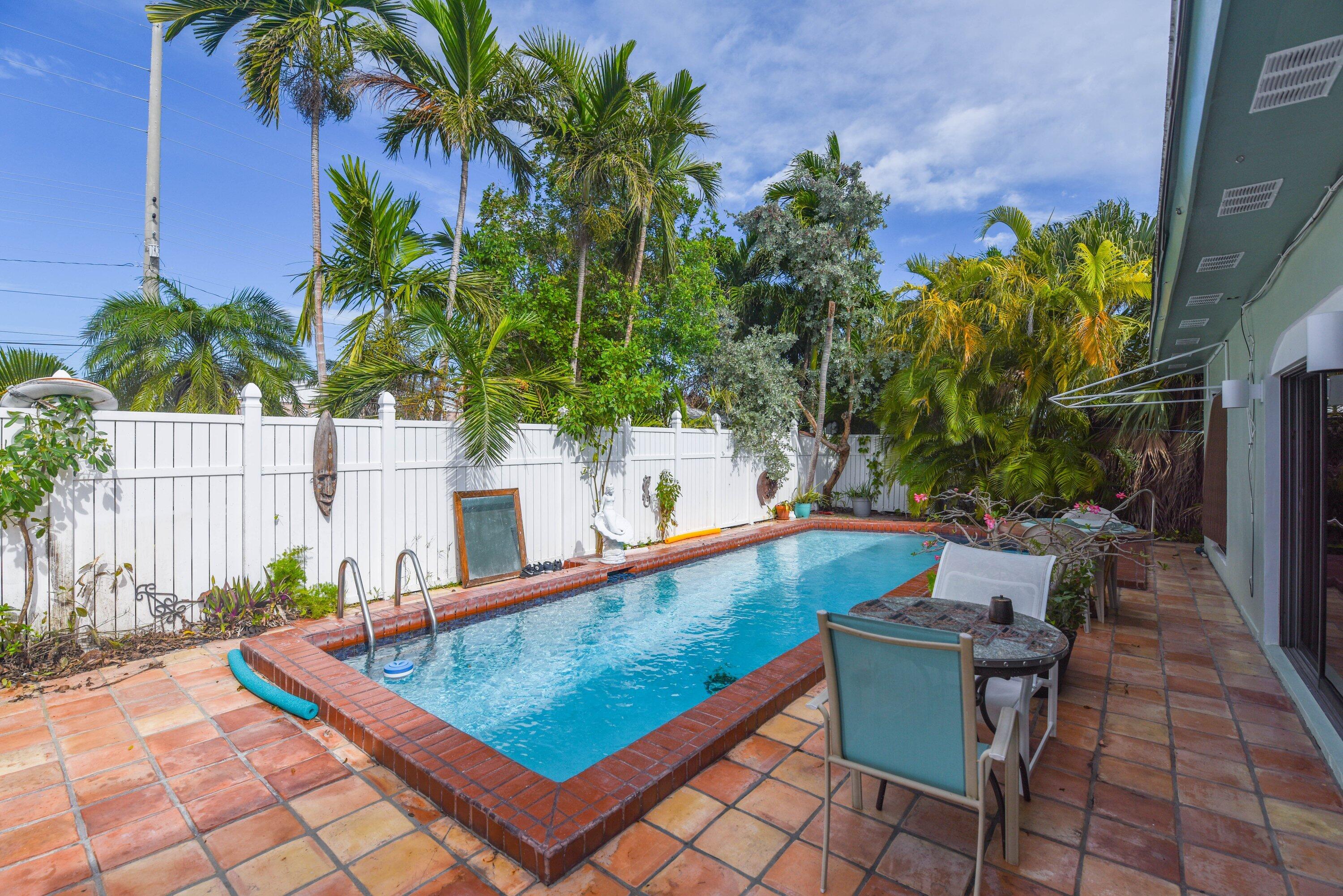 a view of a chairs and table in the patio