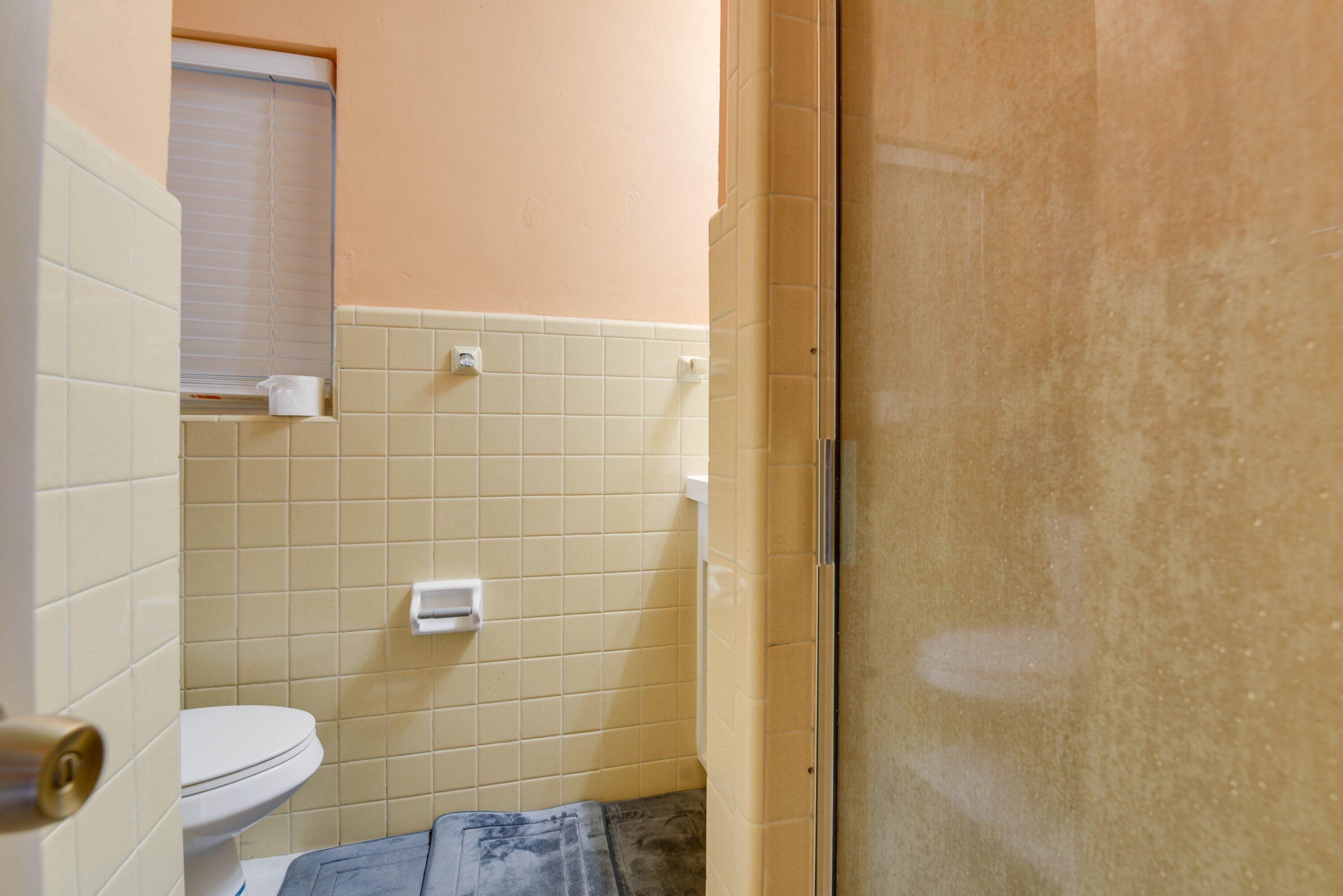 3421 Riviera Drive Key West, FL 33040 - Photo 17 of 32 a bathroom with a toilet and a shower