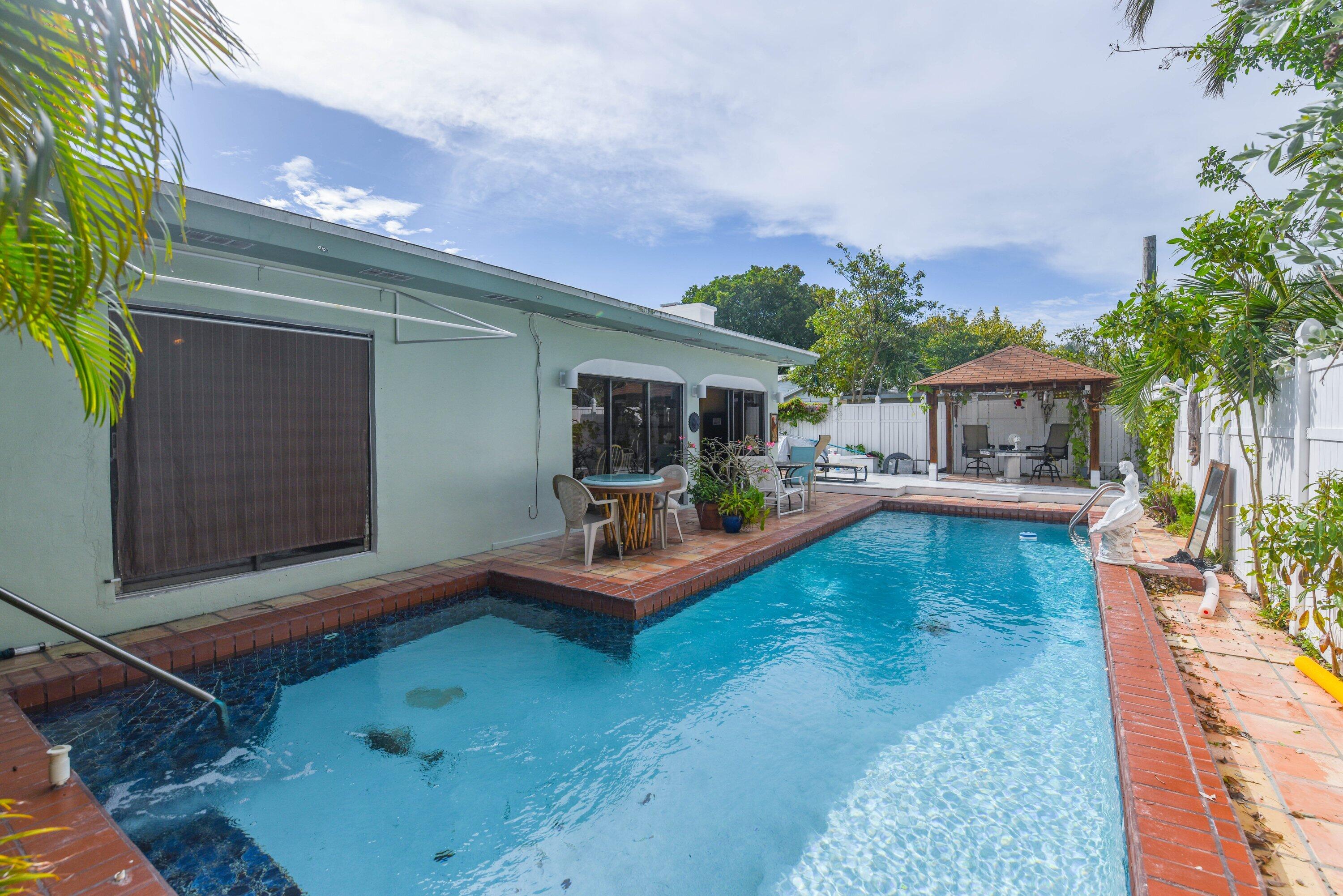 3421 Riviera Drive Key West, FL 33040 - Photo 22 of 32 a view of house with swimming pool outdoor seating