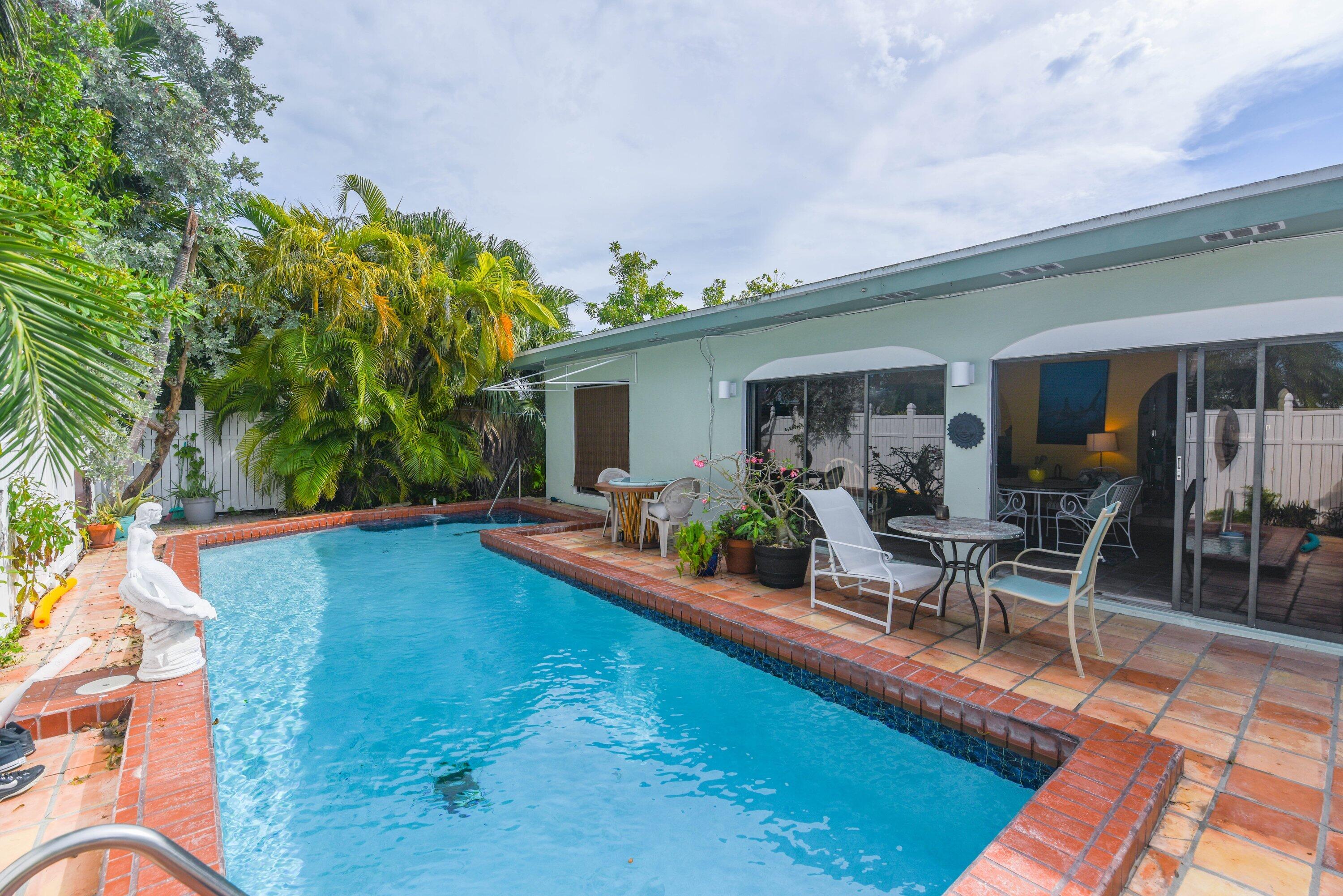3421 Riviera Drive Key West, FL 33040 - Photo 25 of 32 a view of a house with swimming pool and sitting area