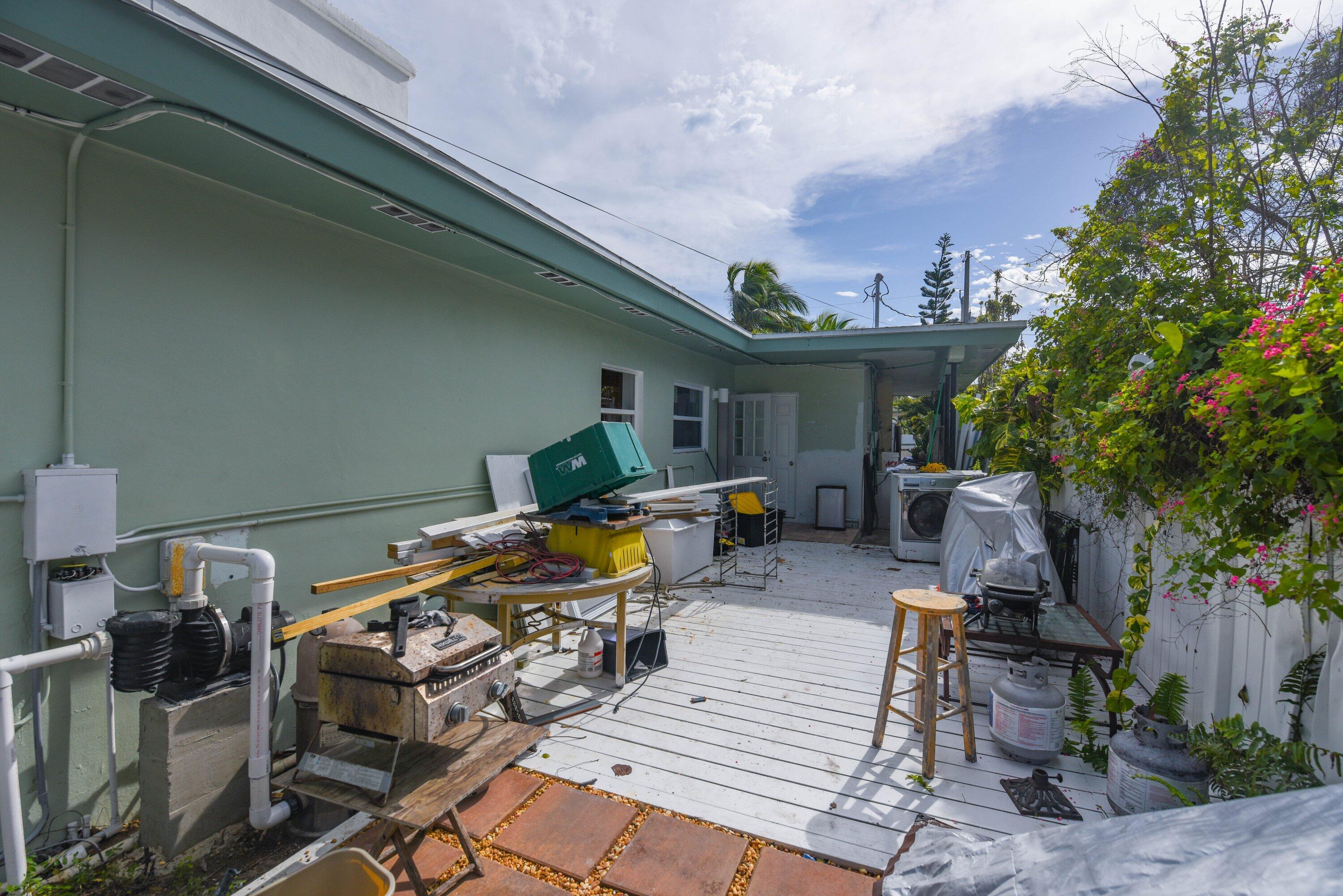3421 Riviera Drive Key West, FL 33040 - Photo 26 of 32 a front view of a house with outdoor seating