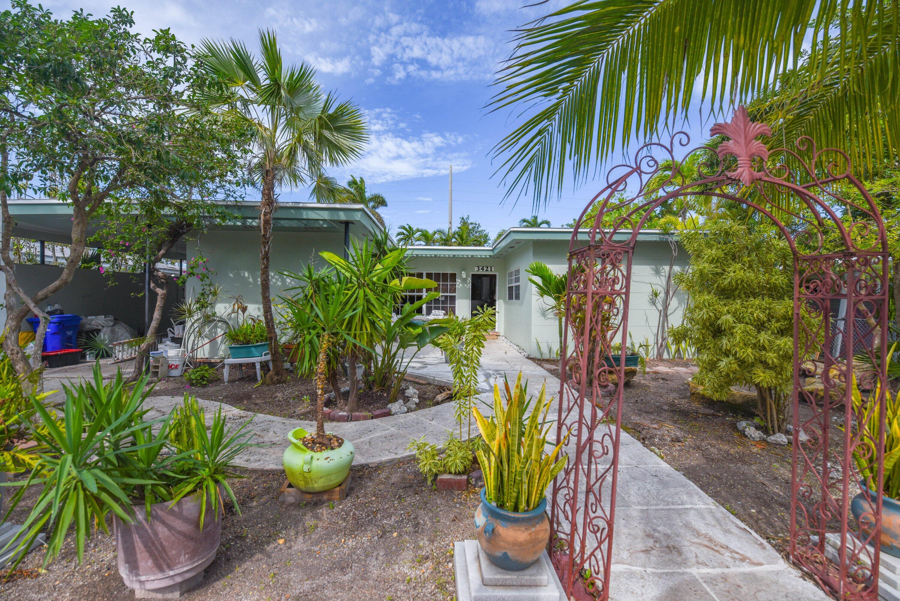 3421 Riviera Drive Key West, FL 33040 - Photo 29 of 32 a front view of a house with patio