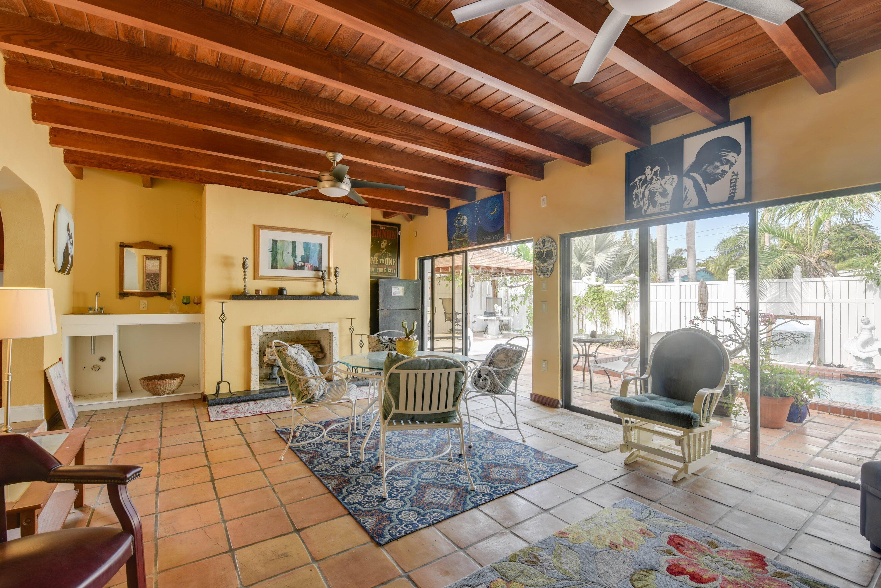 3421 Riviera Drive Key West, FL 33040 - Photo 3 of 32 a living room with furniture and a floor to ceiling window