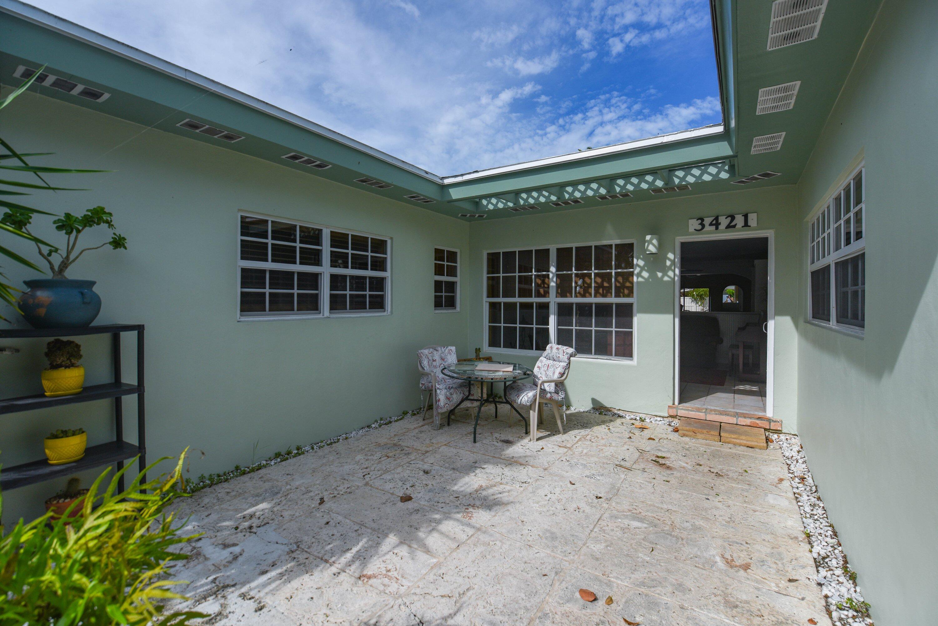 3421 Riviera Drive Key West, FL 33040 - Photo 5 of 32 a view of a house with backyard and sitting area