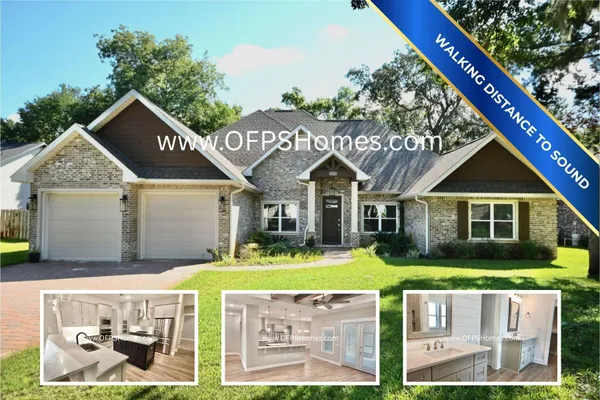 a front view of a house with a yard table and chairs