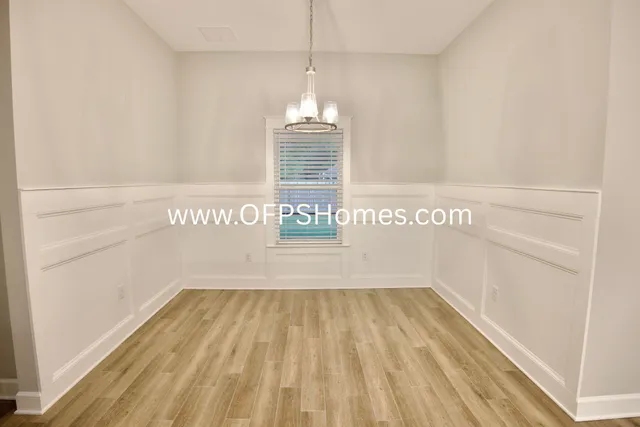 a view of wooden floor with a window