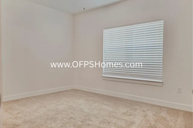 a kitchen with stainless steel appliances granite countertop a refrigerator a stove and a wooden floors