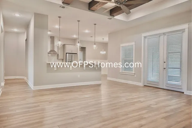 a view of an entryway with wooden floor