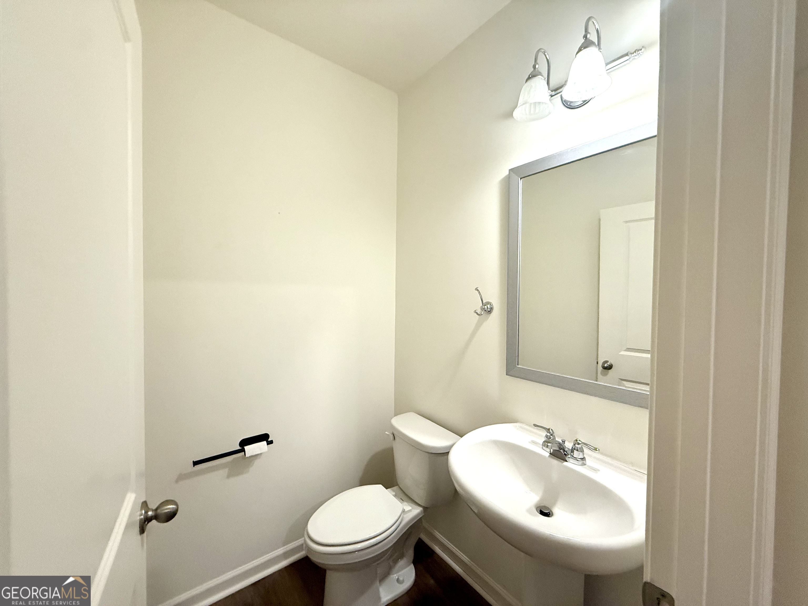 119 Pond Court Hoschton, GA 30548 - Photo 11 of 29 a bathroom with a sink mirror and toilet