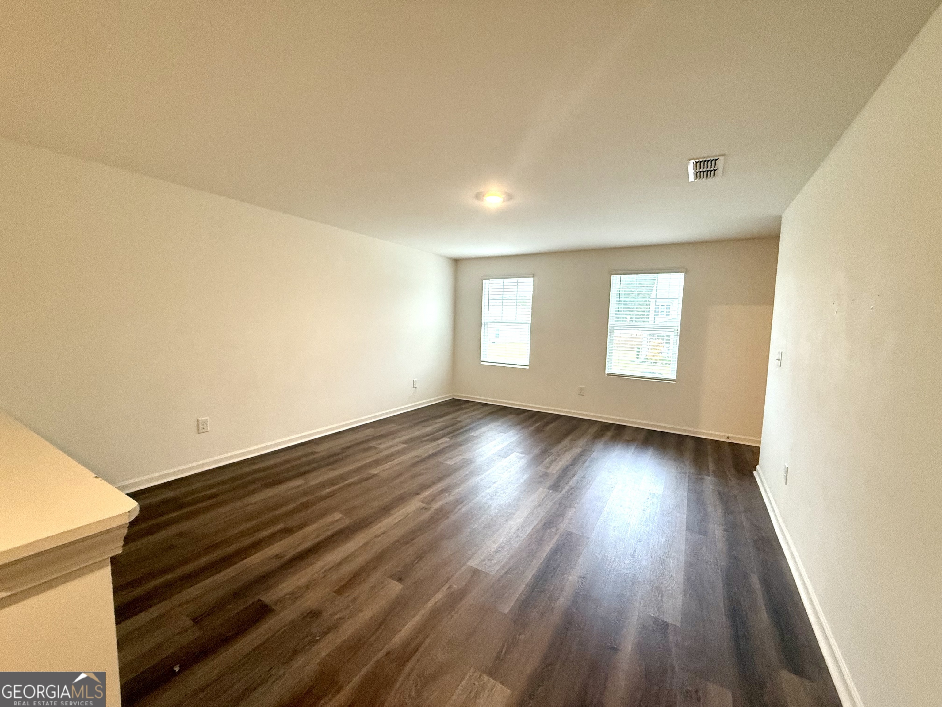 119 Pond Court Hoschton, GA 30548 - Photo 13 of 29 wooden floor in an empty room with a window
