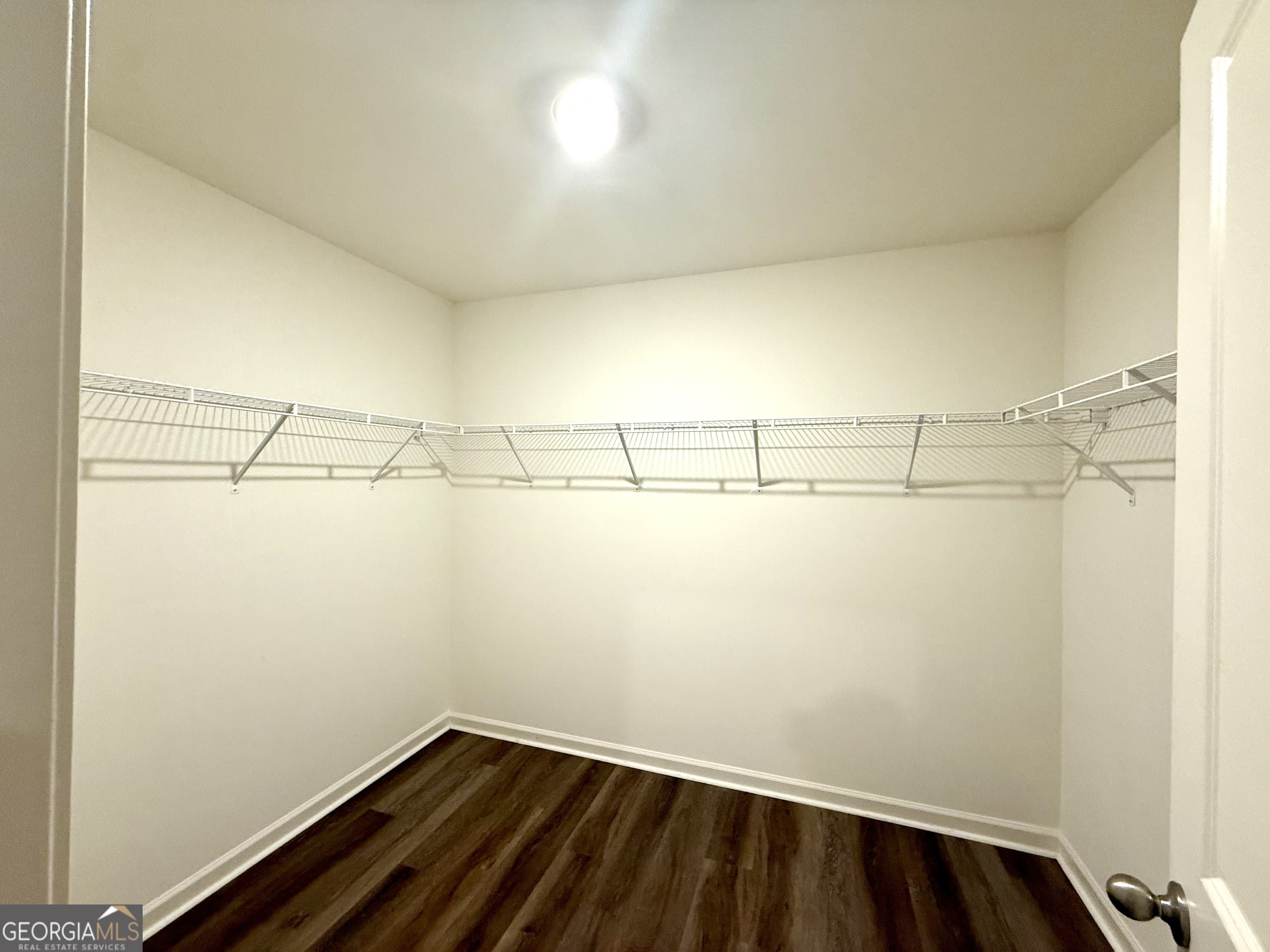 119 Pond Court Hoschton, GA 30548 - Photo 17 of 29 a view of a room with racks on the wall