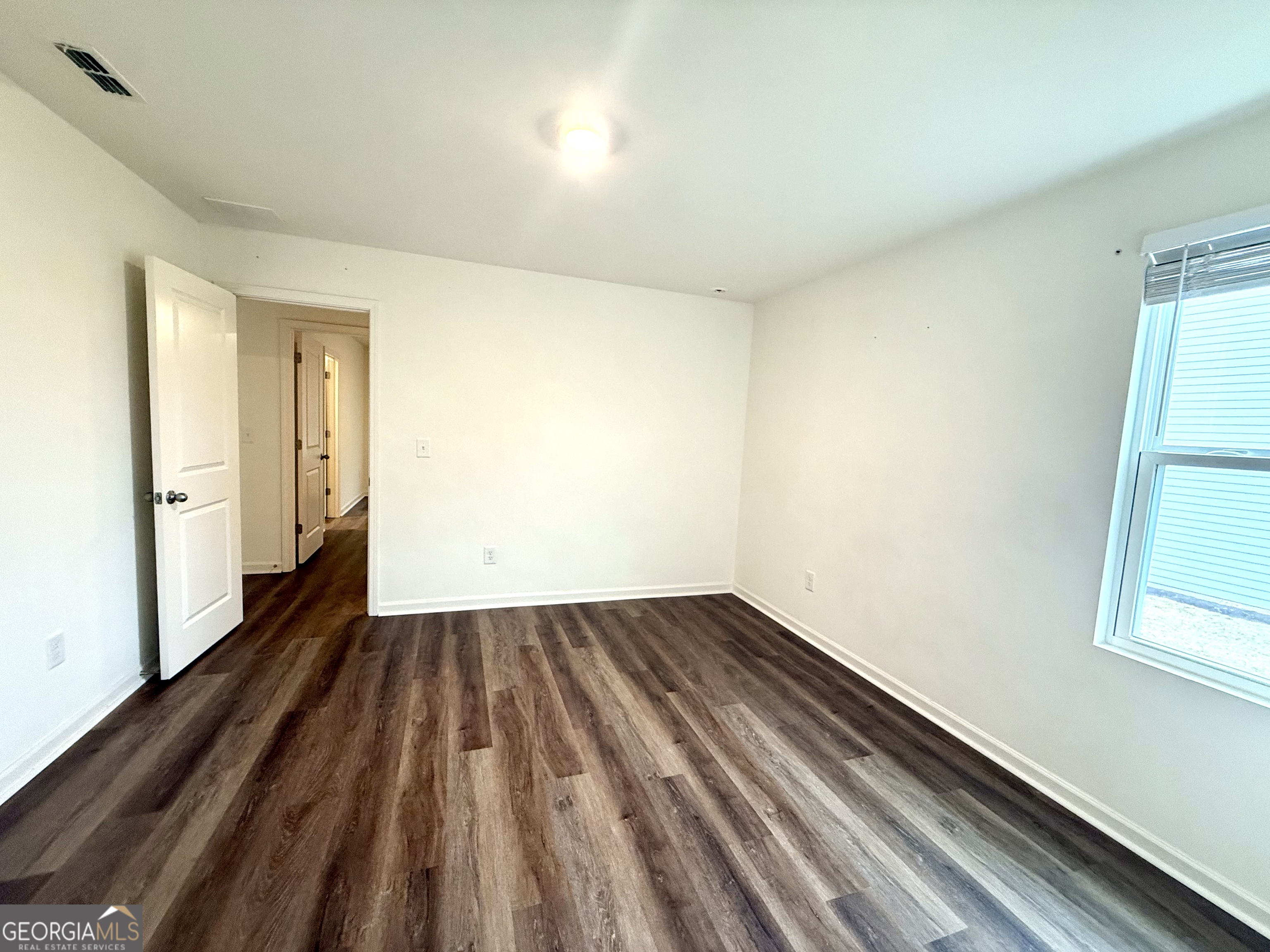 119 Pond Court Hoschton, GA 30548 - Photo 20 of 29 a view of wooden floor in an empty room
