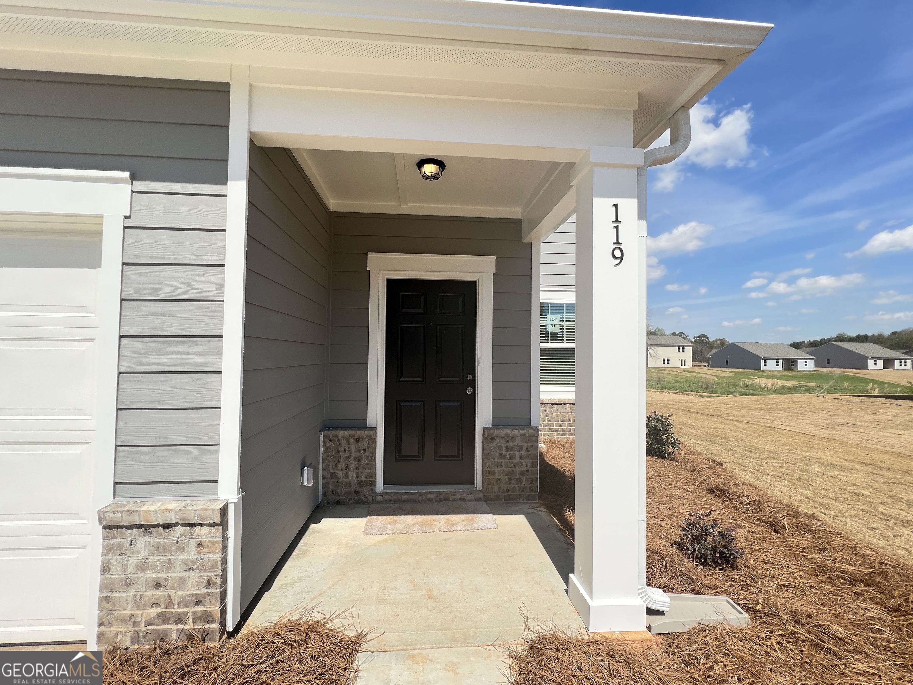 119 Pond Court Hoschton, GA 30548 - Photo 2 of 29 a view of a balcony