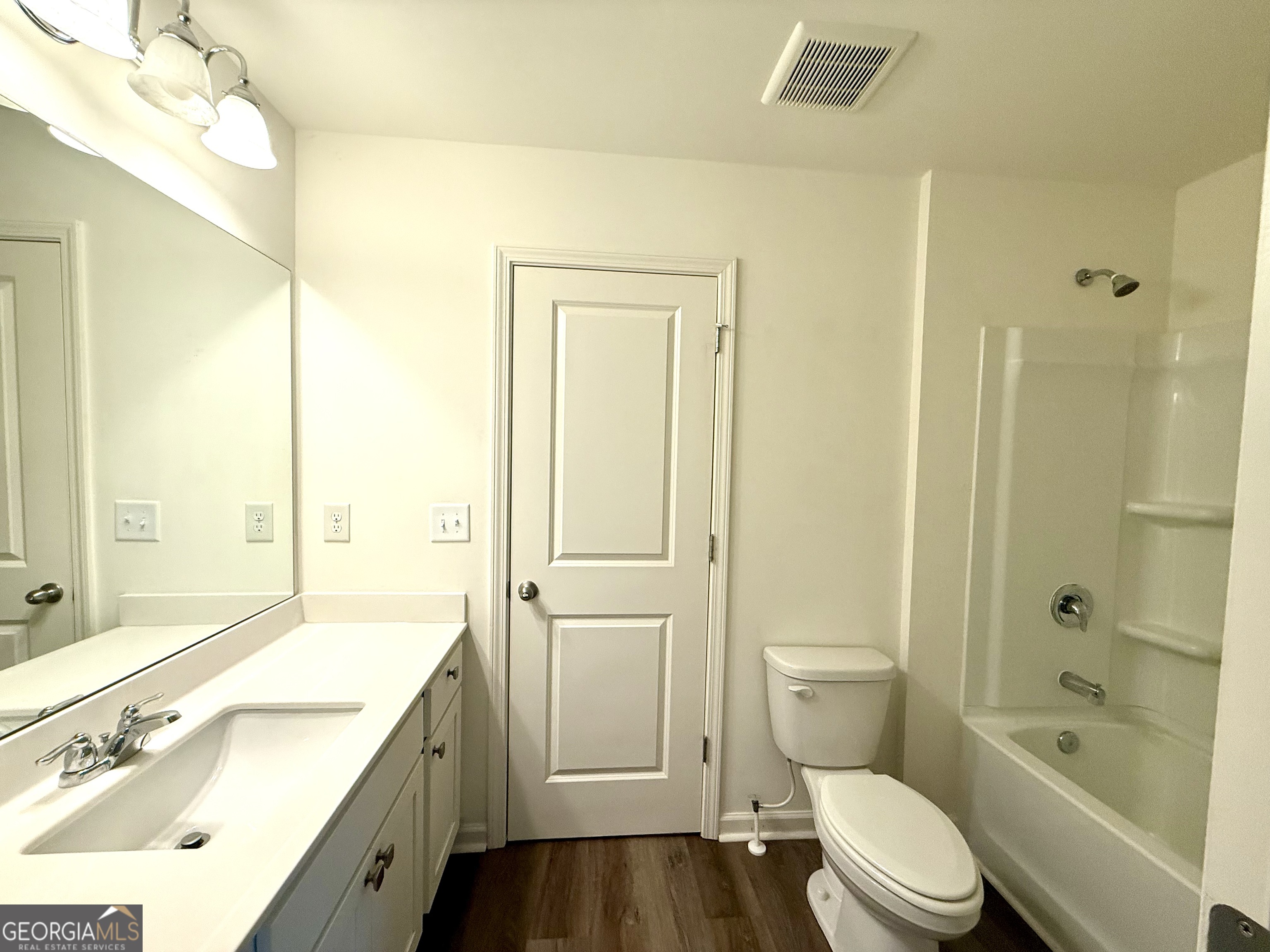 119 Pond Court Hoschton, GA 30548 - Photo 21 of 29 a bathroom with a granite countertop sink a toilet and shower
