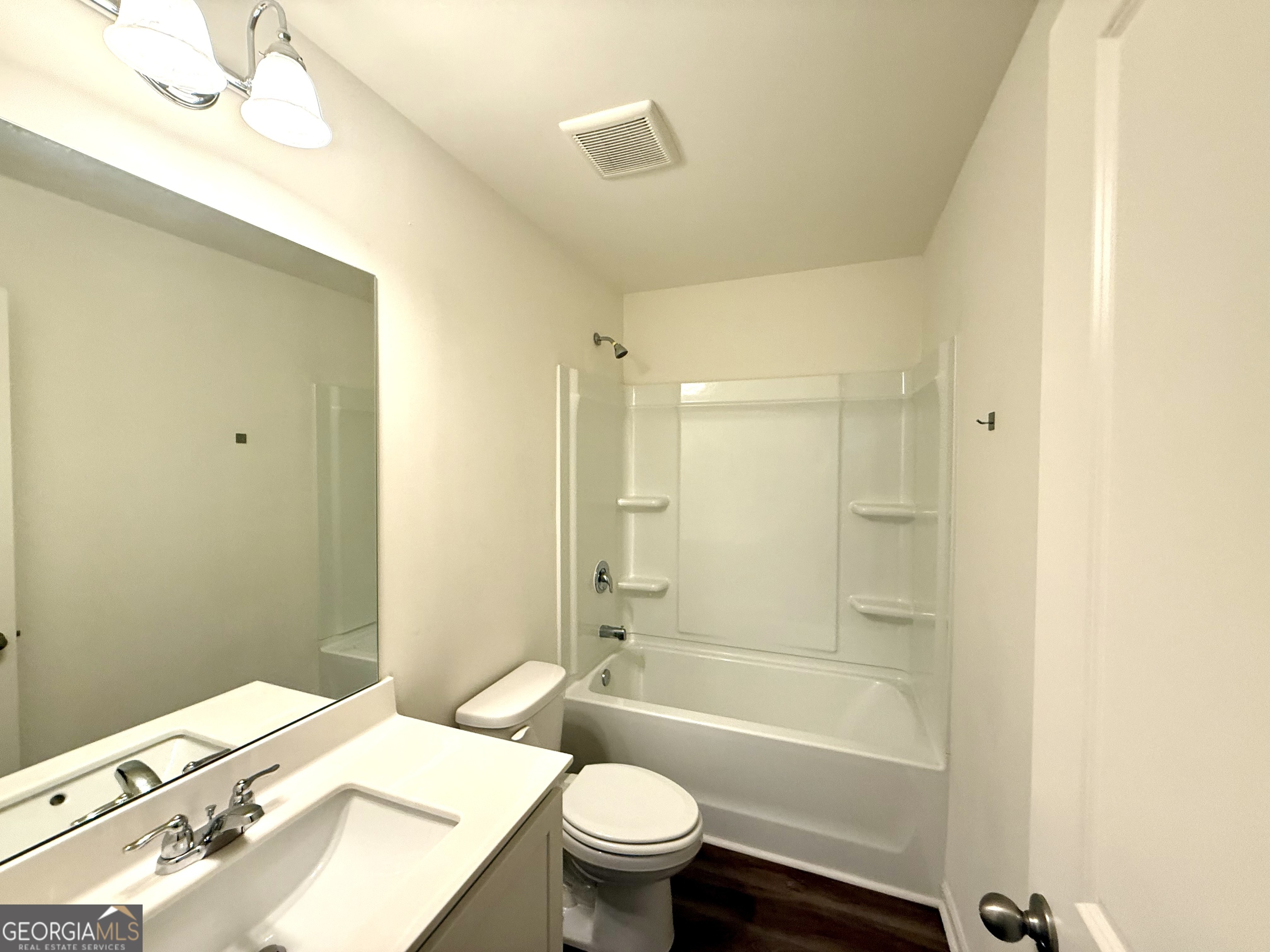 119 Pond Court Hoschton, GA 30548 - Photo 25 of 29 a bathroom with a sink a toilet and shower