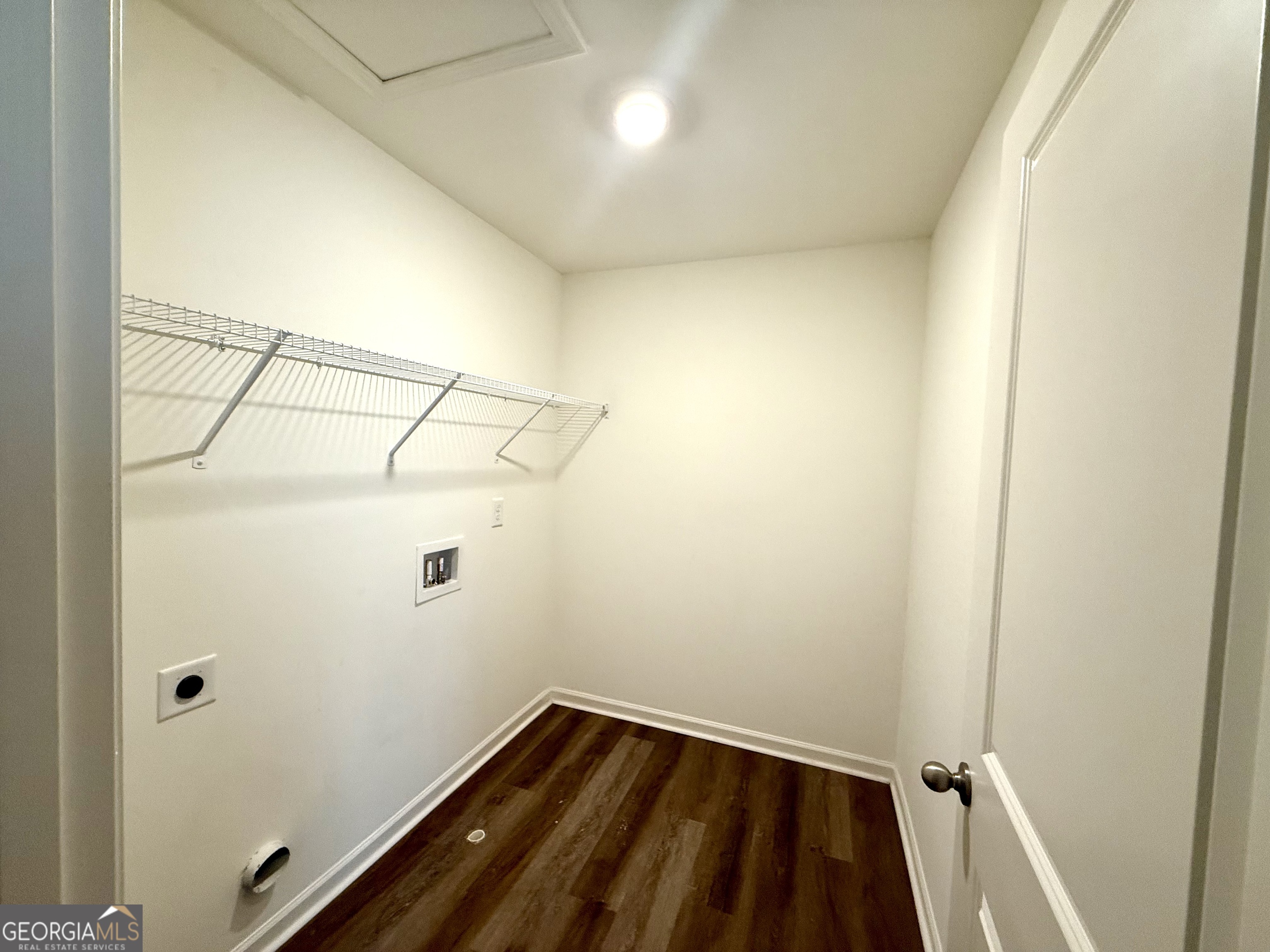 119 Pond Court Hoschton, GA 30548 - Photo 27 of 29 a view of a room with racks on the wall